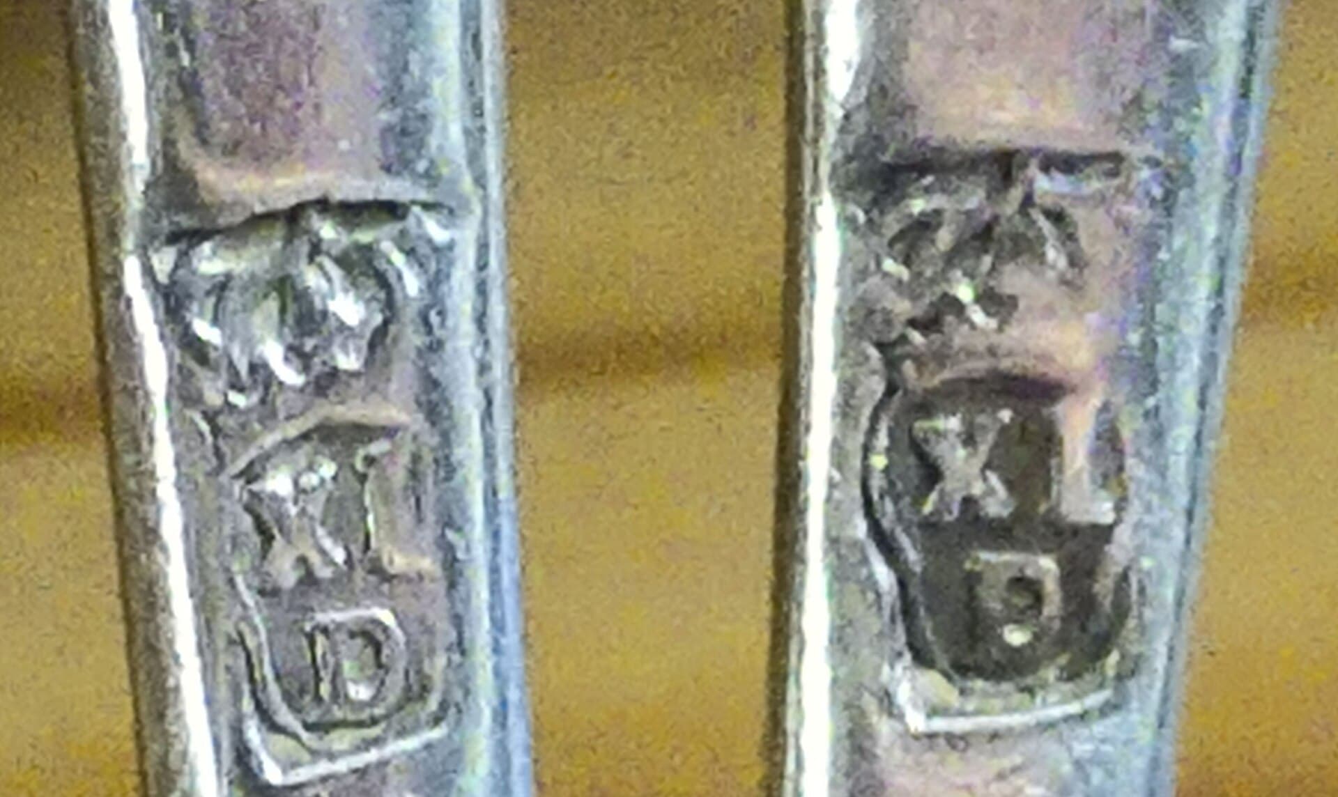Silver hallmarks. A trade solved proof of origin with a stamp several centuries ago.